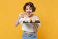 Young brunette woman girl in casual clothes hold in hand makizushi sushi roll served on black plate traditional japanese Royalty Free Stock Photo