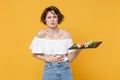 Young brunette woman girl in casual clothes hold in hand makizushi sushi roll served on black plate traditional japanese Royalty Free Stock Photo