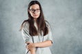 Young brunette woman in glasses, self-confidence. Smiling and calm girl