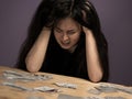 Young Brunette Woman Grieves in Desperation because She Lost All Her Money on Playing Cards.