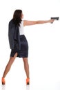 Young brunette woman with gun on white Royalty Free Stock Photo