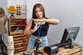 Young brunette woman holding banner with open text at retail shop doing time out gesture with hands, frustrated and serious face Royalty Free Stock Photo