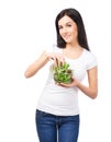 Young brunette woman holding a fresh salad Royalty Free Stock Photo