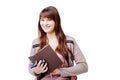 Young brunette woman holding a notebook and pen on white isolated background Royalty Free Stock Photo