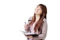 Young brunette woman holding a notebook and pen on white isolated background Royalty Free Stock Photo