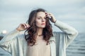 Young brunette woman with long curly brown hair relaxing outdoor Royalty Free Stock Photo