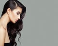 Young brunette woman with long perfect hairstyle. Hair care and beauty salon background Royalty Free Stock Photo