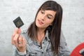 Young brunette woman looking at film slide Royalty Free Stock Photo