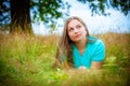 Young brunette woman on the meadow Royalty Free Stock Photo