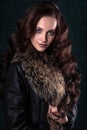 Young brunette woman with perfect natural makeup and hair style wearing furs. Royalty Free Stock Photo