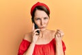 Young brunette woman with short hair having conversation talking on the smartphone annoyed and frustrated shouting with anger, Royalty Free Stock Photo