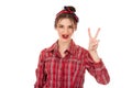 Woman showing and pointing up with fingers number two