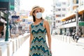 20s Hispanic Brunette woman in a protective mask wear summer sleeveless summ dress in Asia.