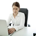 Young brunette woman is uncertain on her desk