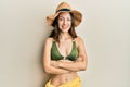 Young brunette woman wearing bikini happy face smiling with crossed arms looking at the camera Royalty Free Stock Photo