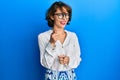 Young brunette woman wearing casual clothes and glasses pointing fingers to camera with happy and funny face Royalty Free Stock Photo