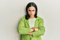 Young brunette woman wearing casual clothes skeptic and nervous, disapproving expression on face with crossed arms Royalty Free Stock Photo