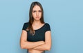 Young brunette woman wearing casual clothes skeptic and nervous, disapproving expression on face with crossed arms Royalty Free Stock Photo