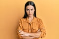 Young brunette woman wearing casual clothes skeptic and nervous, disapproving expression on face with crossed arms Royalty Free Stock Photo