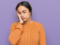 Young brunette woman wearing casual winter sweater thinking looking tired and bored with depression problems with crossed arms