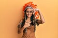 Young brunette woman wearing indian costume smiling making frame with hands and fingers with happy face Royalty Free Stock Photo