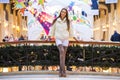 Young brunette woman in white fur coat and high suede boots Royalty Free Stock Photo