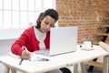 Young brunette woman working hard from her home office.  Space for text Royalty Free Stock Photo