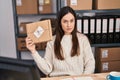 Young brunette woman working at small business ecommerce thinking attitude and sober expression looking self confident Royalty Free Stock Photo