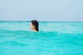 Young brunette woman in yellow one piece swimsuit. Royalty Free Stock Photo