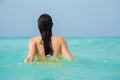 Young brunette woman in yellow one piece swimsuit. Royalty Free Stock Photo