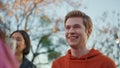 Young buddies celebrating party at rooftop closeup. Friends clinking glasses