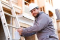 Young builder using disinfectant soap on construction site. Royalty Free Stock Photo