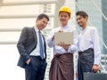 Young Burmese businessmen meet and talk about their business through Internet search, During working hours outside the office