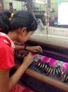 Young Burmese women weaving