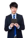 Young business asian man using his tablet Royalty Free Stock Photo