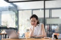 Young Business Asian women are stressed while working on laptop, Tired asian businesswoman with headache at office Royalty Free Stock Photo