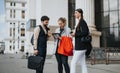 Young business associates discussing market trends and profit growth in an outdoor meeting Royalty Free Stock Photo