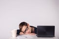 Young business boy fell asleep at the table Royalty Free Stock Photo