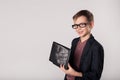 Young business boy holding laptop in his hands Royalty Free Stock Photo