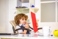 Young business boy. Little boss in office. Young businessman using a laptop. Child handsome boy in office. Seriously Royalty Free Stock Photo