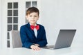 Young business boy. smiling child in glasses. little boss in office.funny kids Royalty Free Stock Photo