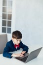 Young business boy. smiling child in glasses. little boss in office.funny kids Royalty Free Stock Photo