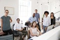 Young business colleagues smiling to camera in their office Royalty Free Stock Photo