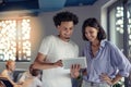 Young business couple working on tablet in modern office Royalty Free Stock Photo