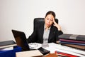 Young business dressed woman working at her desk