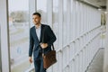 Young business executive with briefcase going up the stairs Royalty Free Stock Photo