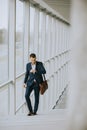 Young business executive with briefcase going up the stairs Royalty Free Stock Photo