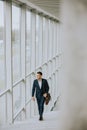 Young business executive with briefcase going up the stairs Royalty Free Stock Photo