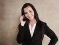 Young business executive smiling while on phone