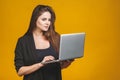 Young business happy smiling woman holding laptop and sending email to her best friend Royalty Free Stock Photo